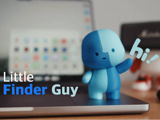 Lil' Finder Guy standing on a laptop